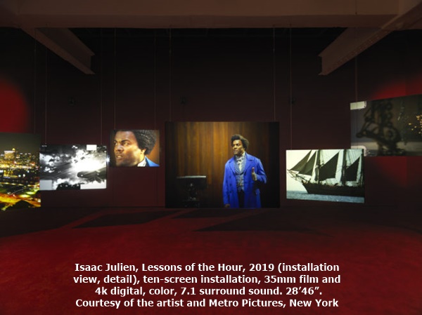 Isaac Julien, Lessons of the Hour, 2019 (installation view, detail), ten-screen installation, 35mm film and 4k digital, color, 7.1 surround sound. 28’46”. Courtesy of the artist and Metro Pictures, New York