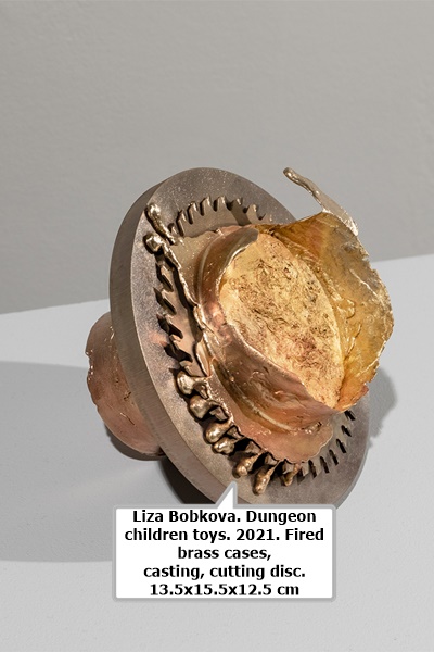 Liza Bobkova. Dungeon children toys. 2021. Fired brass cases, casting, cutting disc. 13.5x15.5x12.5 cm